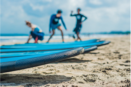 Blue surfboards in the sand on the, a Nature Photo by Elizaveta Galitskaya