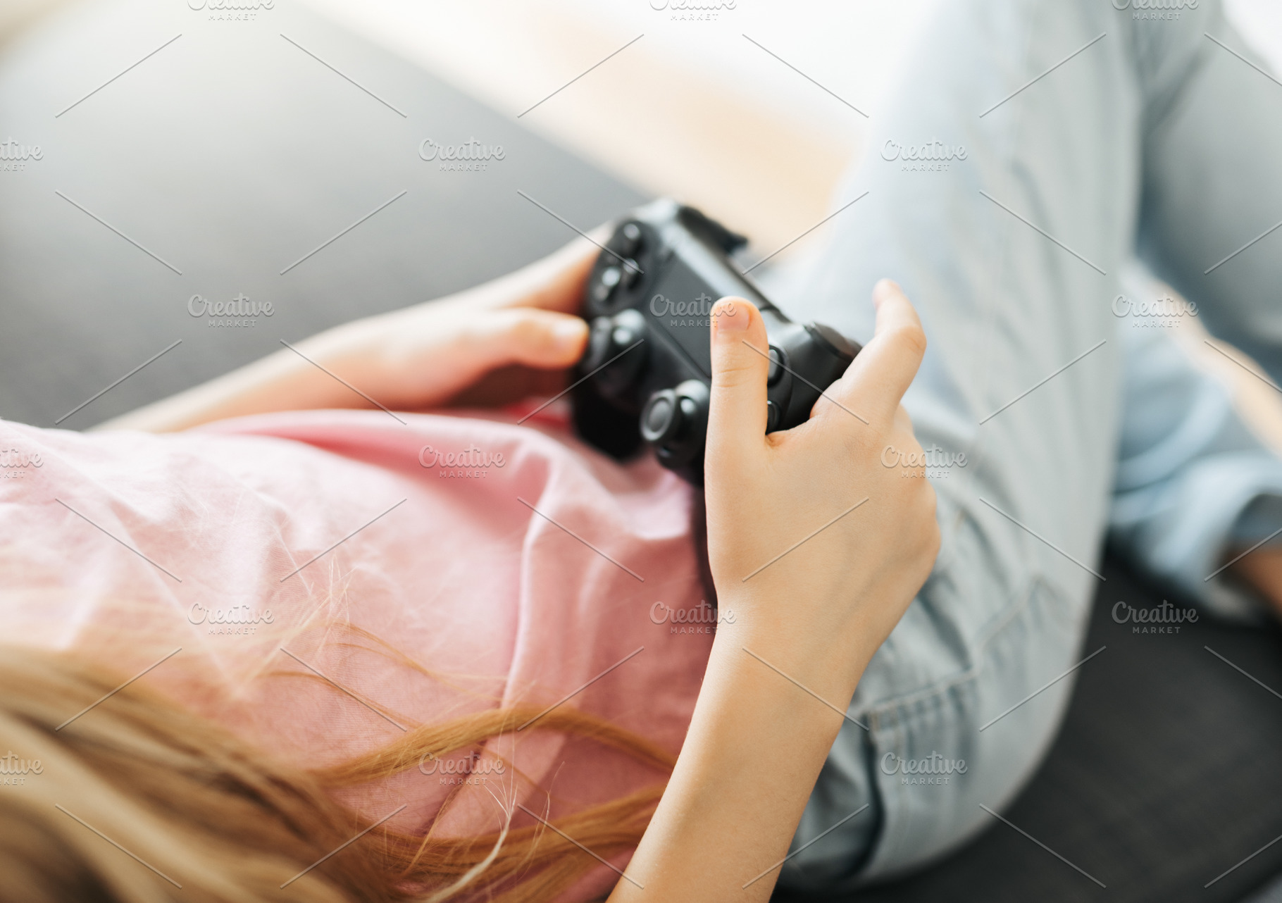 Girl playing video game at home, a Sports & Recreation Photo by Olena Rudo