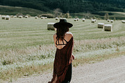 Woman walking down the road, a Person Photo by Wild Wander Collective (Thumbnail 1 of 2)