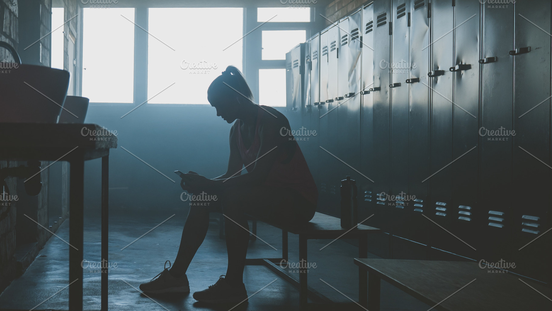 Female choosing music for workout, a Sports & Recreation Photo by supamotion