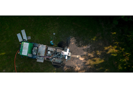 Aerial shot of water well drilling, an Industrial Photo by HalfPoint