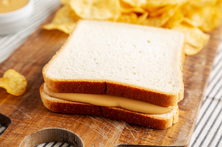 Homemade American Peanut Butter Sandwich on a Wooden Board, side