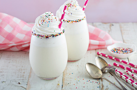 Vanilla milkshake with whipped cream and sprinkles featuring vanilla, a Food & Drink Photo by farwasser
