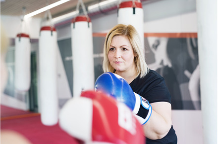 Overweight woman is working out in, a Sports & Recreation Photo by HalfPoint