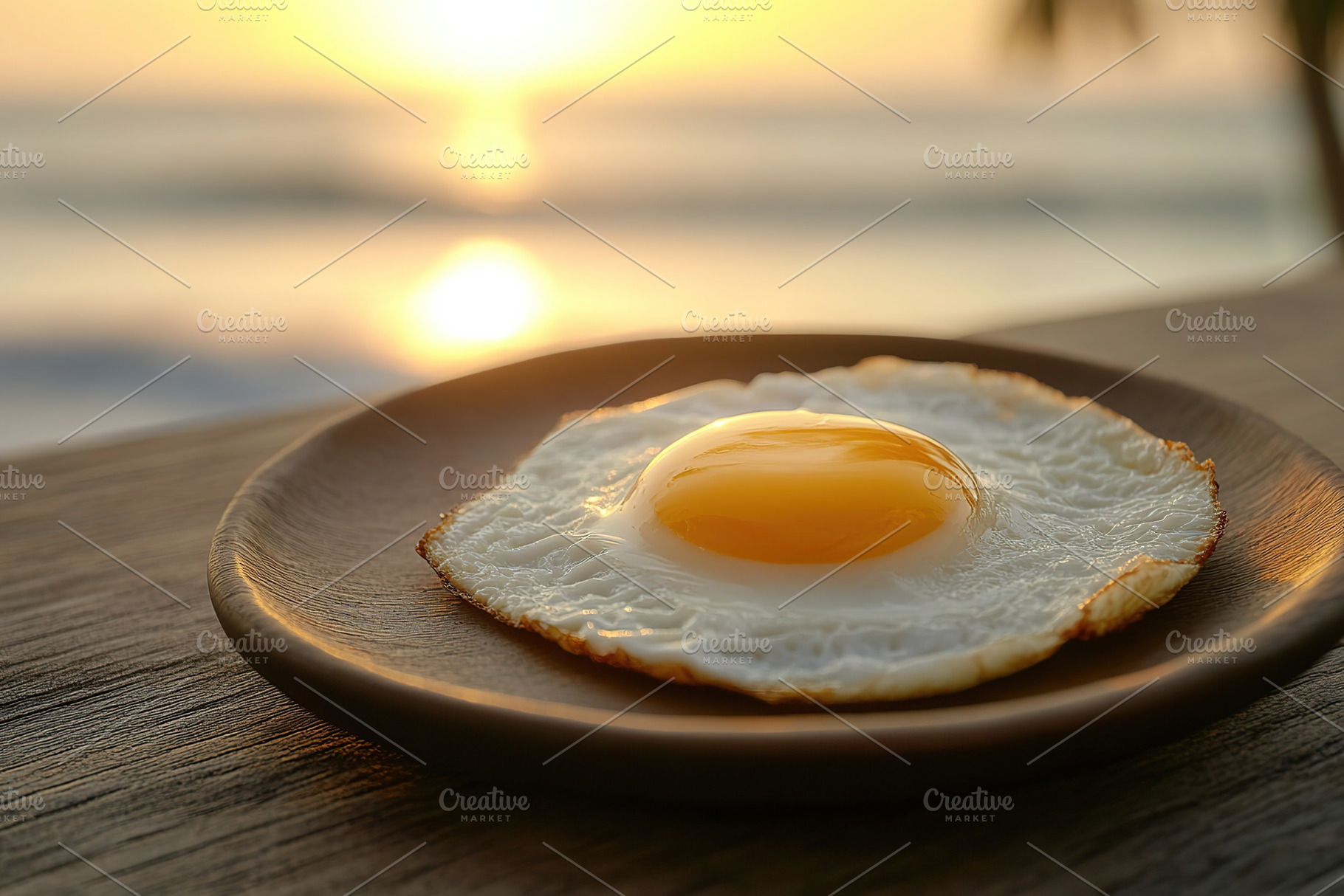 Heart-shaped fried egg with golden yolk against sunset backdrop by the beach, a Food & Drink Photo by AlyaAnd