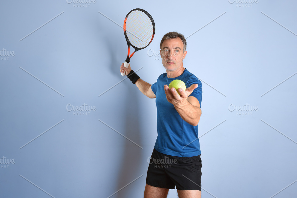 Middle-Aged Tennis Player Holding Racket and Ball, a Sports & Recreation Photo by Davizro's Market (Photo 1 of 2)