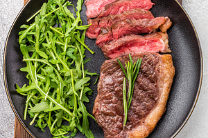 Tender grilled striploin New York steak paired with fresh vegeta, a Food & Drink Photo by composter-box@mail.ru