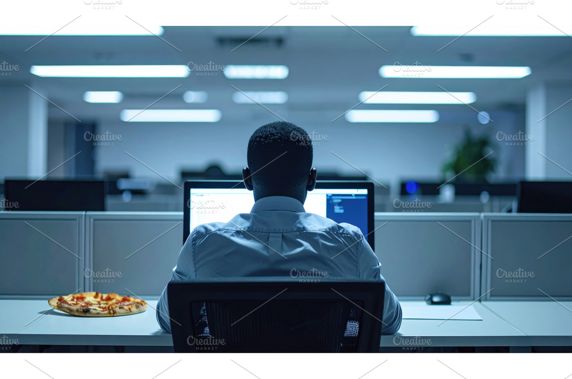 Man working alone late in a, a Business Photo by Igor Tichonow