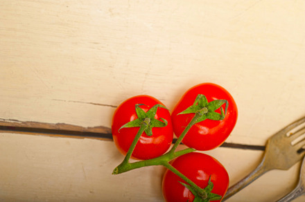 ripe cherry tomatoes over white wood, a Food & Drink Photo by keko64