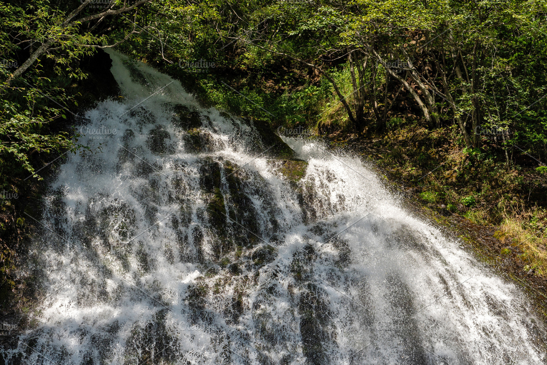 Top of waterfall crashing over rocks, a Nature Photo by Elena Vagengeim
