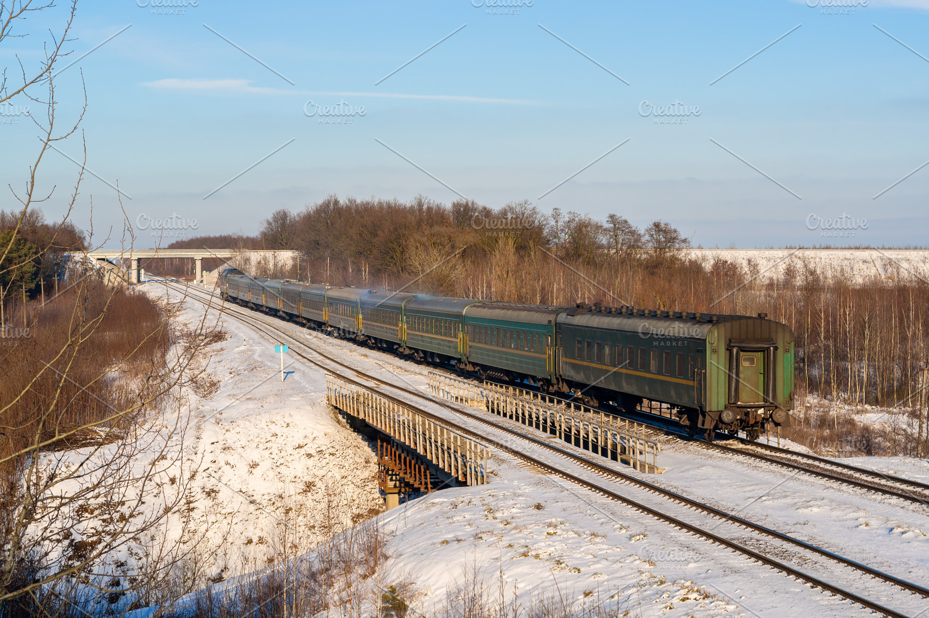 Passenger train during wintertime in Ukraine, a Transportation Photo by Leonid Andronov
