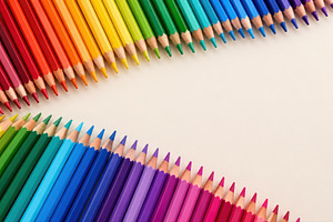 Colorful pencils arranged in a wave