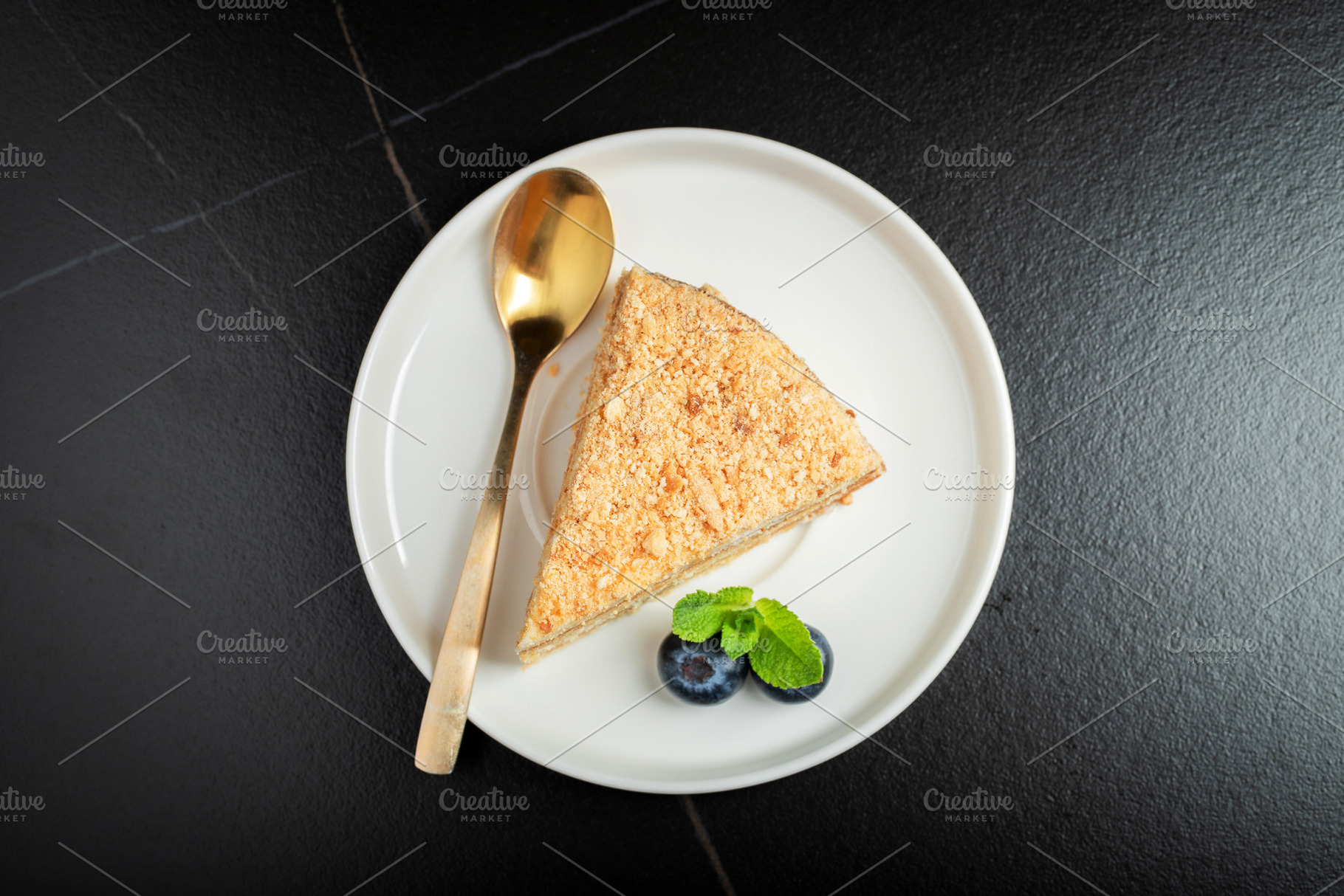 Medovik. Honey cake made from honey cakes with whipped sour cream, decorated wi, a Food & Drink Photo by Budarinphoto