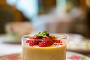 Strawberry cheesecake mousse served in a glass on a decorative p, a Food & Drink Photo by Studio ANNA