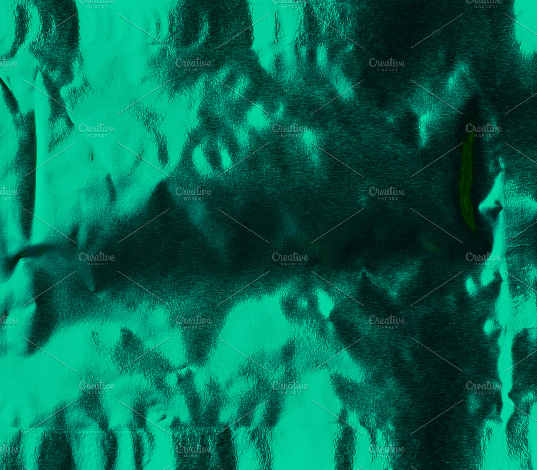 Green crumpled foil with metallic shine, glossy texture of emera, a Background Photo by ndanko