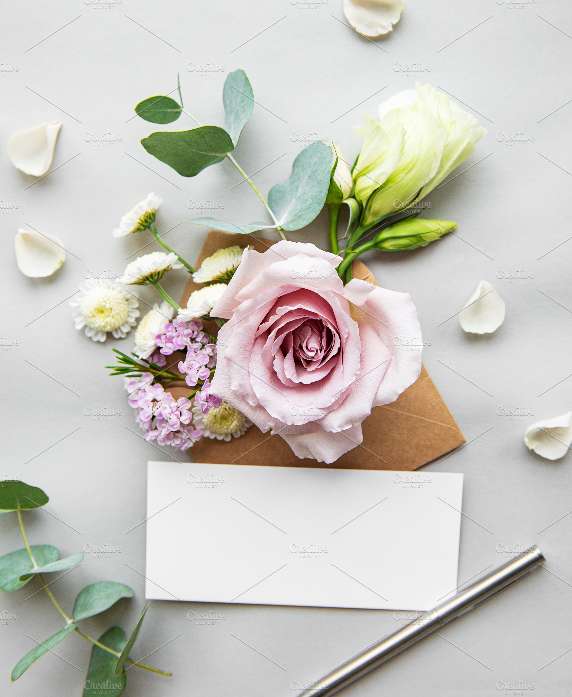 Envelope full of various flowers stock photo containing eucalyptus and roses, a Holiday Photo by Olena Rudo