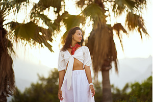 Woman in Elegant Beach Outfit