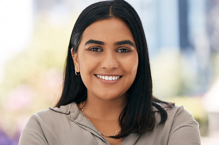 Portrait smile woman, happy closeup in office and small business owner in workplace with happiness. Marketing startup leader, entrepreneur management and leadership with excited confident face at job, a Photo by Peopleimages.com