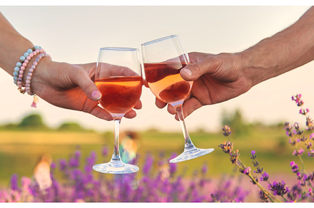 Wine in glasses is held by a woman, a Person Photo by yanadjana