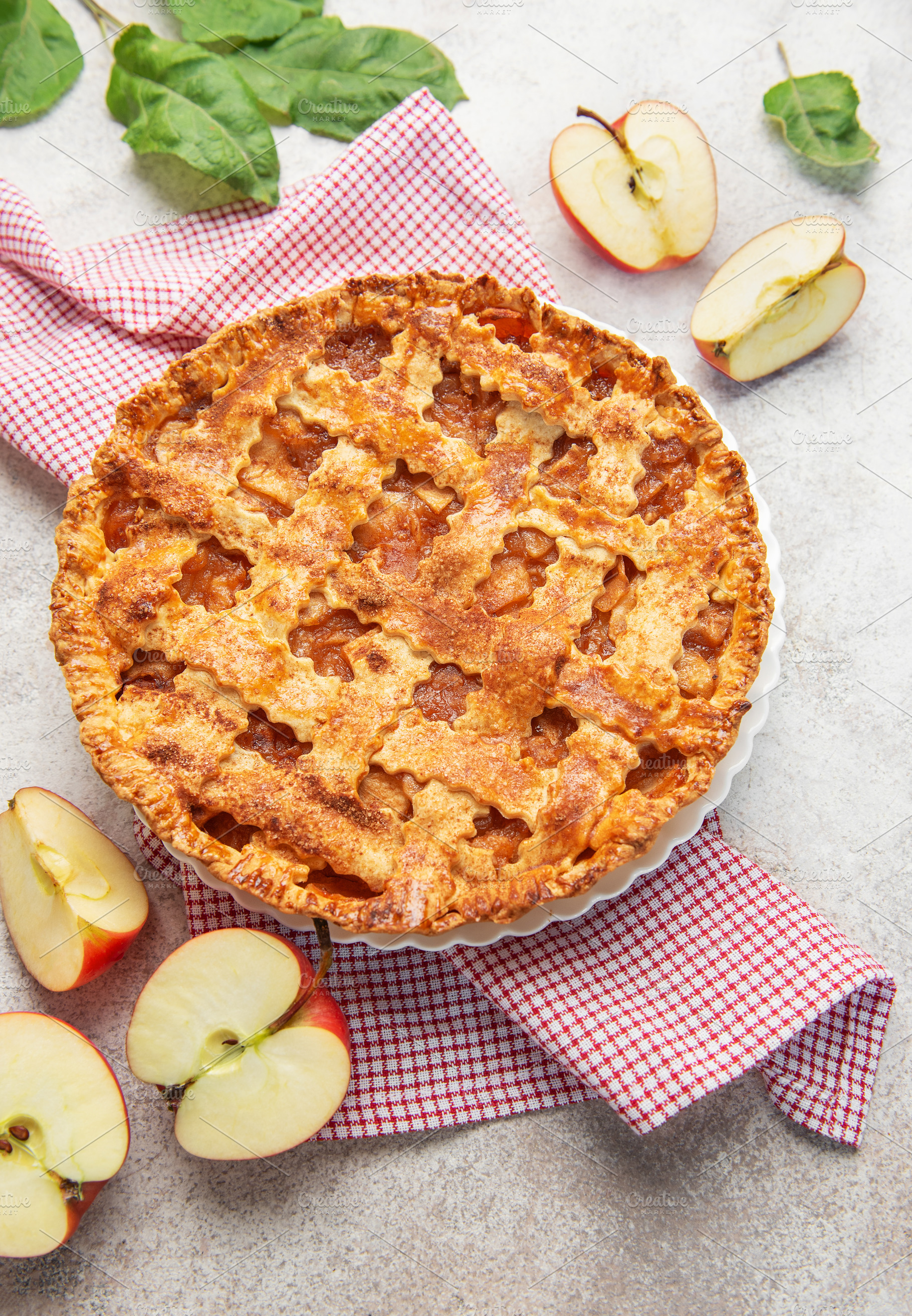 Delicious homemade apple pie decorated with fresh apple slices a, a Food & Drink Photo by Olena Rudo