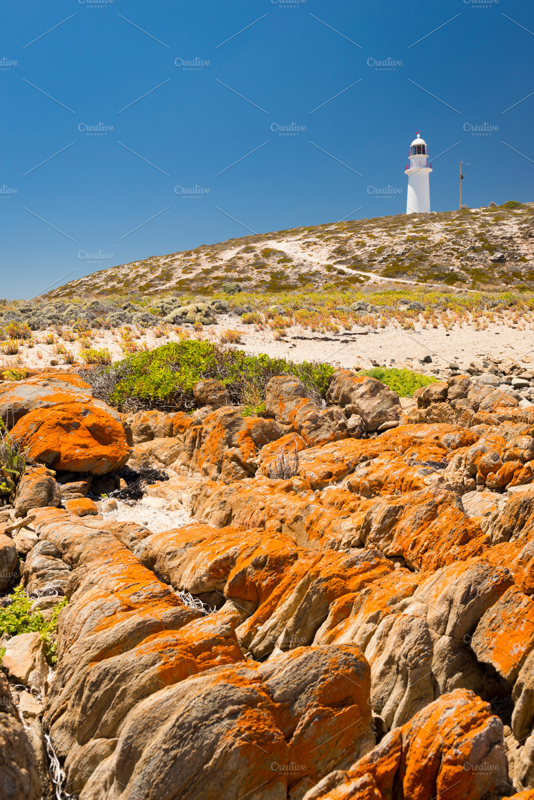 Lighthouse and Rocks, a Nature Photo by THP Creative