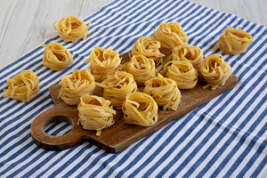 Raw Organic Dry Tagliatelle Pasta Ready to Cook, a Food & Drink Photo by LiudmylaChuhunova
