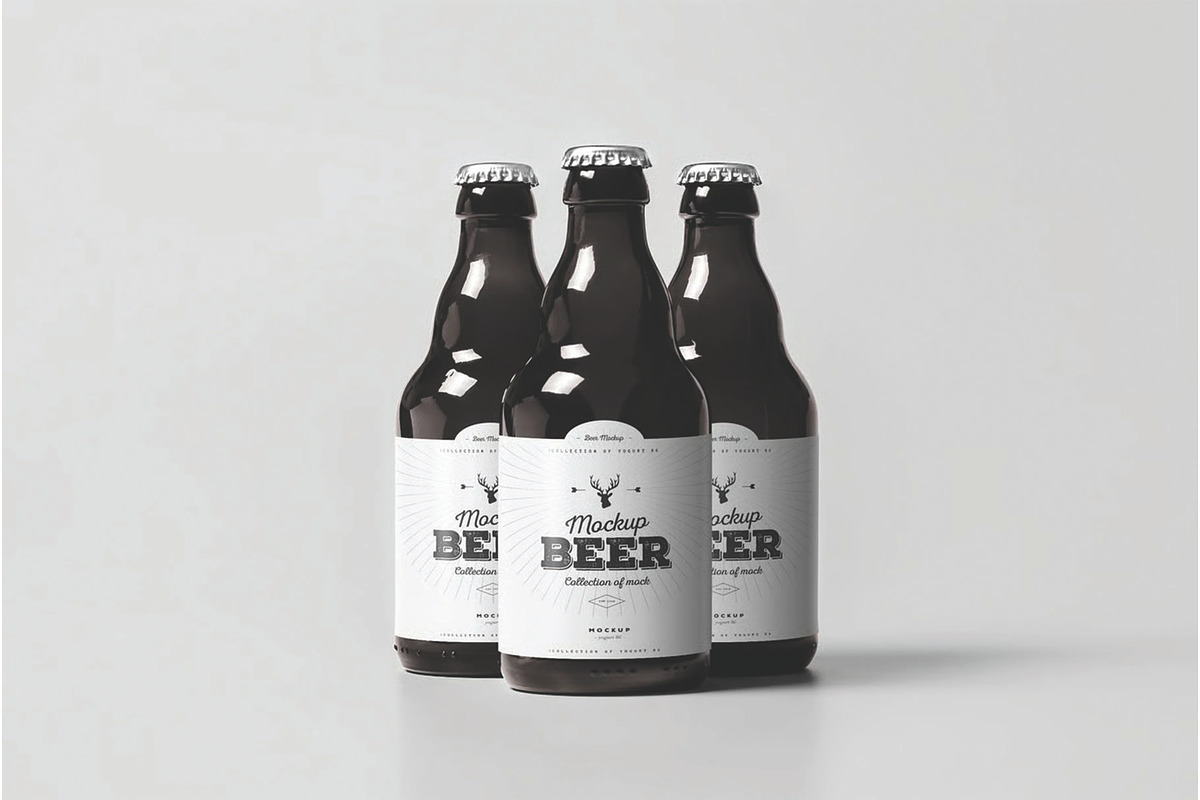 Three Glass Beer Bottles Mockup, an Advertising Mockup by DesignRushMarket (Photo 1 of 2)
