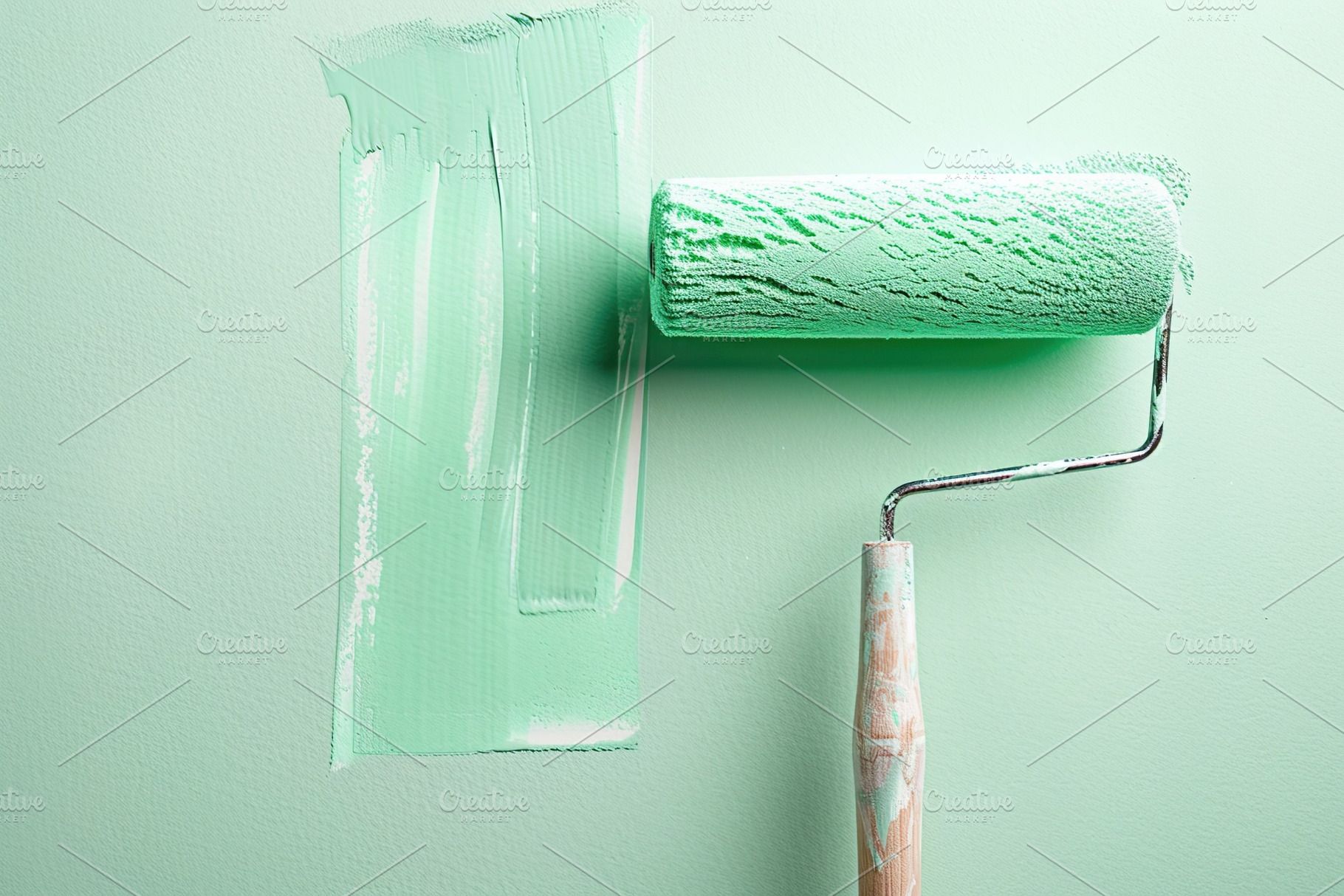 Roller brush with green paint on the wall, an Arts & Entertainment Photo by AlyaAnd
