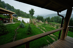Rustic countryside scene with wooden structures surrounded by lush greenery and, a Photo by AS photostudio