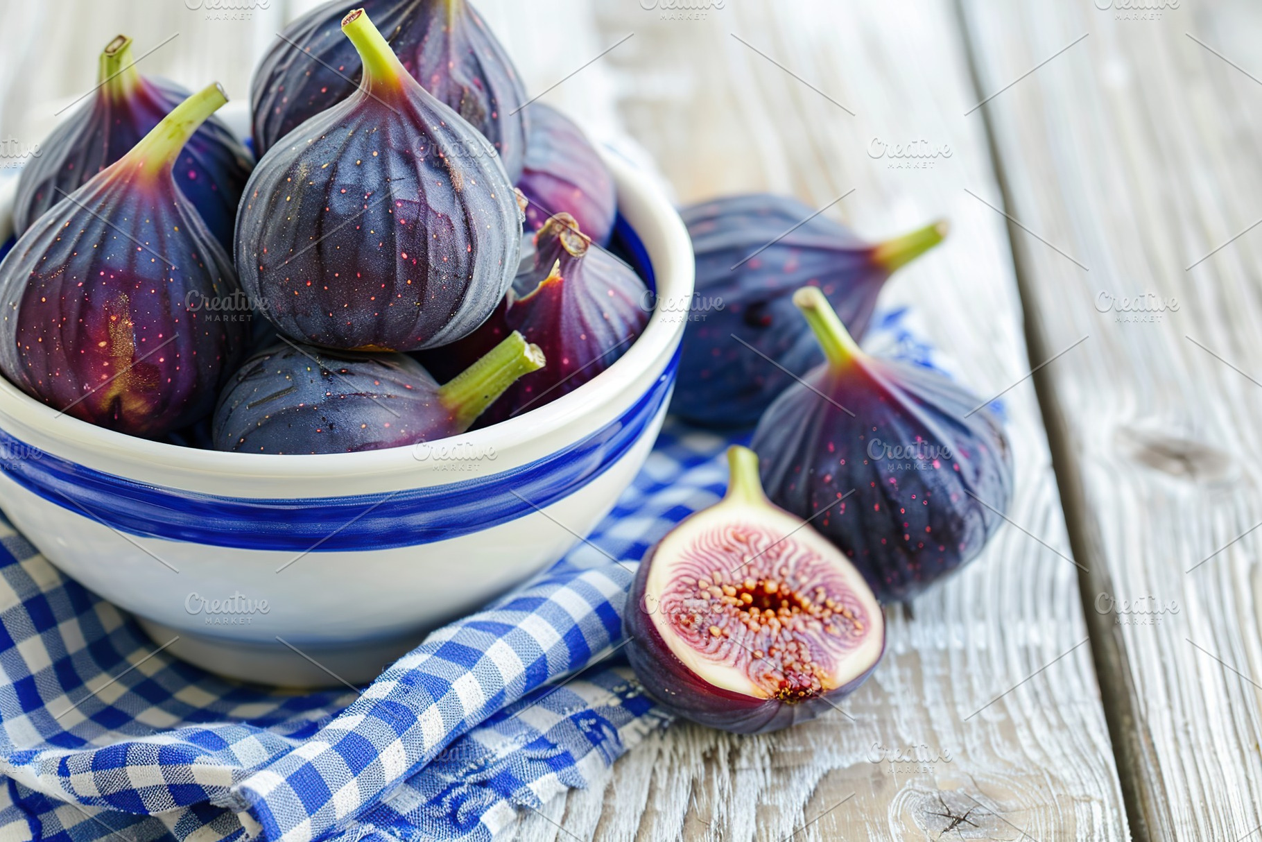 Fresh figs in bowl with napkin on wooden table, a Food & Drink Photo by AlyaAnd