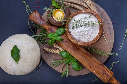 Pizza dough with egg, herbs and flour