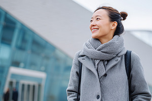 Smiling asian woman in gray coat, a Person Photo by MistyDay