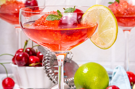 Cherry and lime alcoholic booze cocktail, a Food & Drink Photo by Rimma