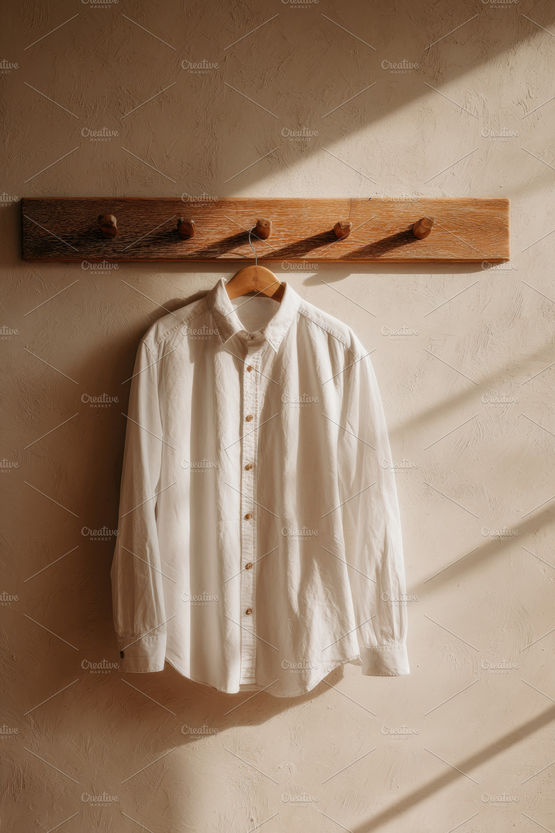 Cotton shirt hanging on peg rail, a Beauty & Fashion Photo by Virgo Studio