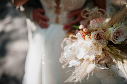 Bride and groom holding beautiful tender wedding bouquet., a Photo by AS photostudio