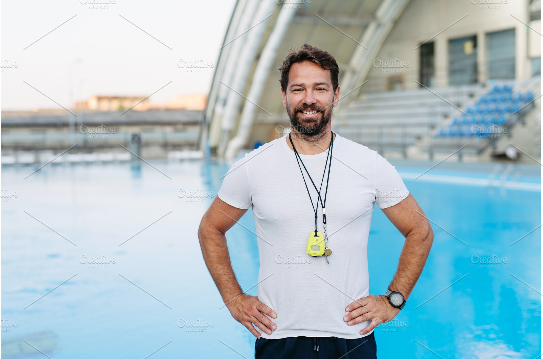 Professional swimming coach standing, a Sports & Recreation Photo by HalfPoint