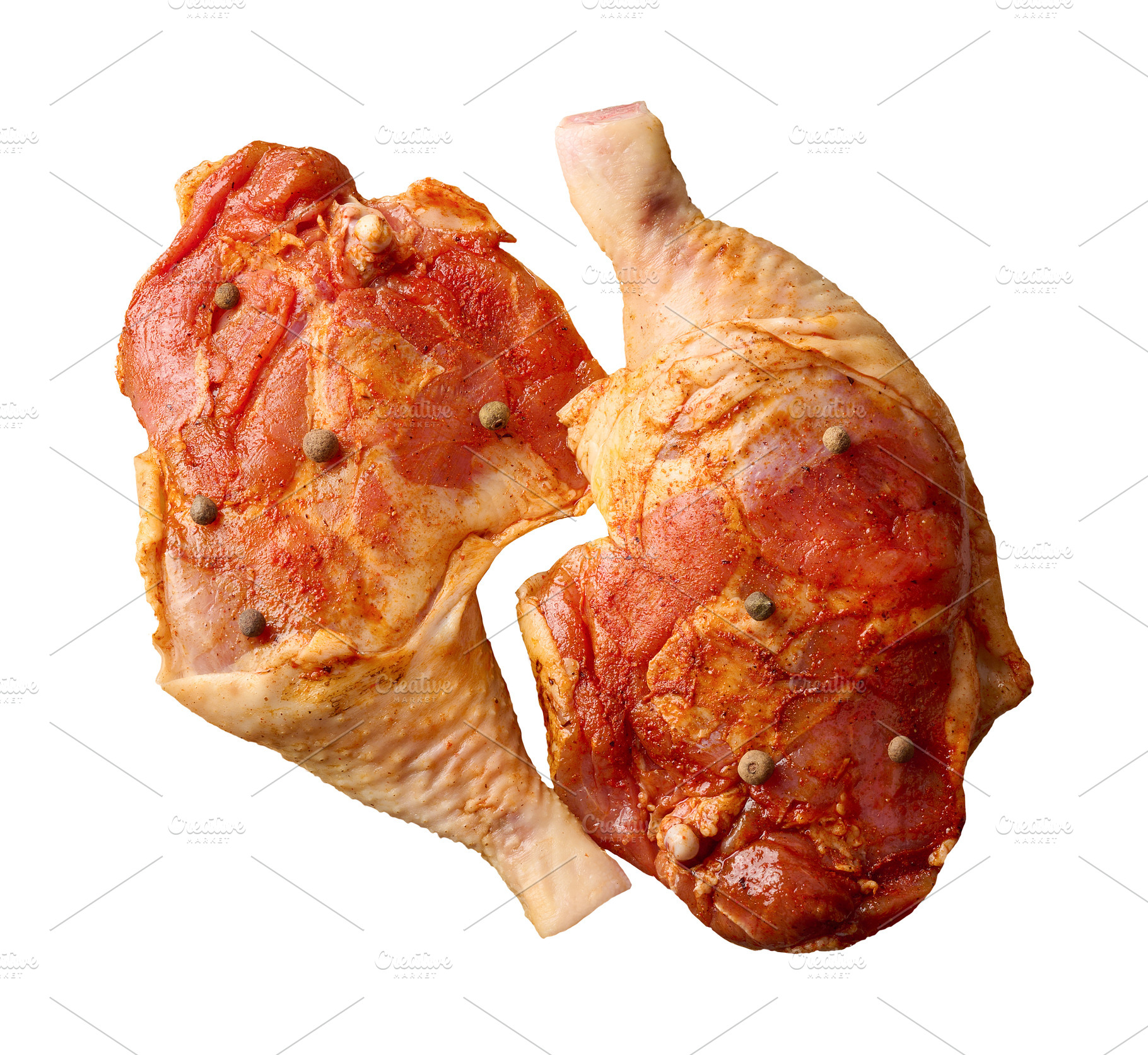 Raw chicken legs and thighs marinated with spices and peppercorn, a Food & Drink Photo by ndanko