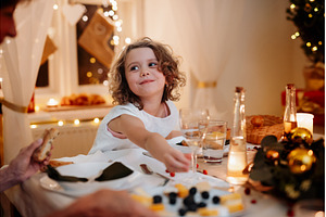 Cheerful small girl during Christmas, a Person Photo by HalfPoint