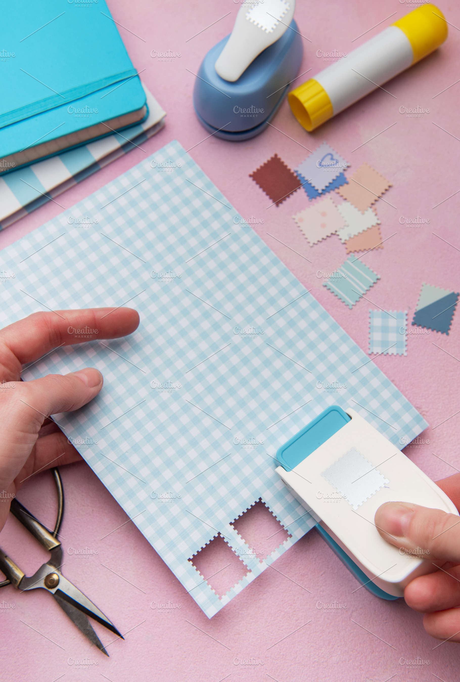 Hand using punch tool creating decorative craft stamps, an Arts & Entertainment Photo by Olena Rudo
