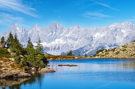 Calm autumn Alps mountain lake with clear transparent water and, a Nature Photo by YuriyB