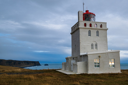 Picturesque autumn evening view to Dyrholaey lighthouse and Reyn, a Nature Photo by YuriyB