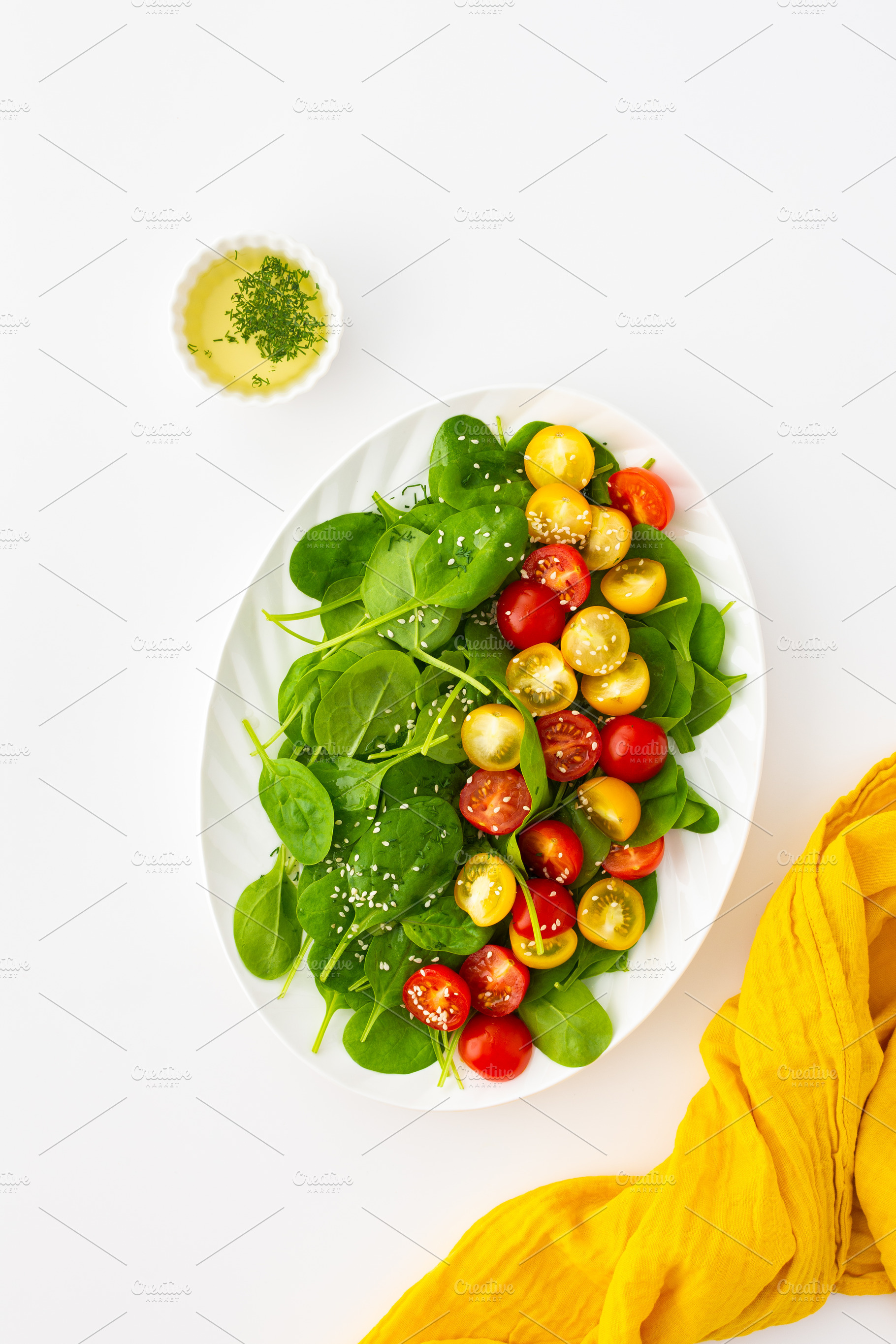 Salad with tomatoes and spinach, a Food & Drink Photo by Pandateam