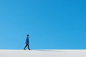 Minimalist landscape with a man walk, a Person Photo by MistyDay