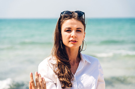 Portrait of smiling fashion woman relaxation on the tropical bea, a Person Photo by Art_Photo