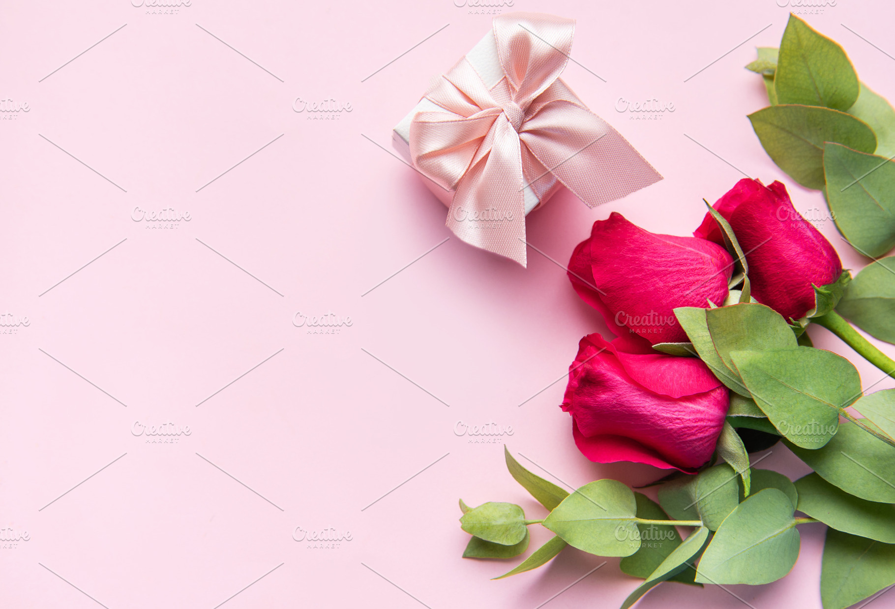 Red roses and gift box for romantic celebration, a Holiday Photo by Olena Rudo