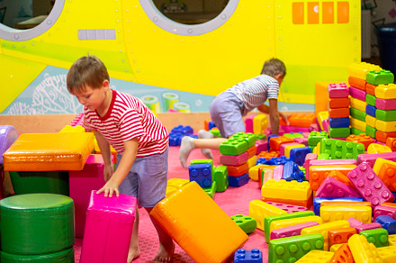 boys playing building toy blocks