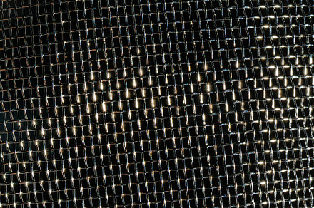 Monochrome texture of a shiny metal colander or grate. Abstract, an Abstract Photo by Eugene_Photo
