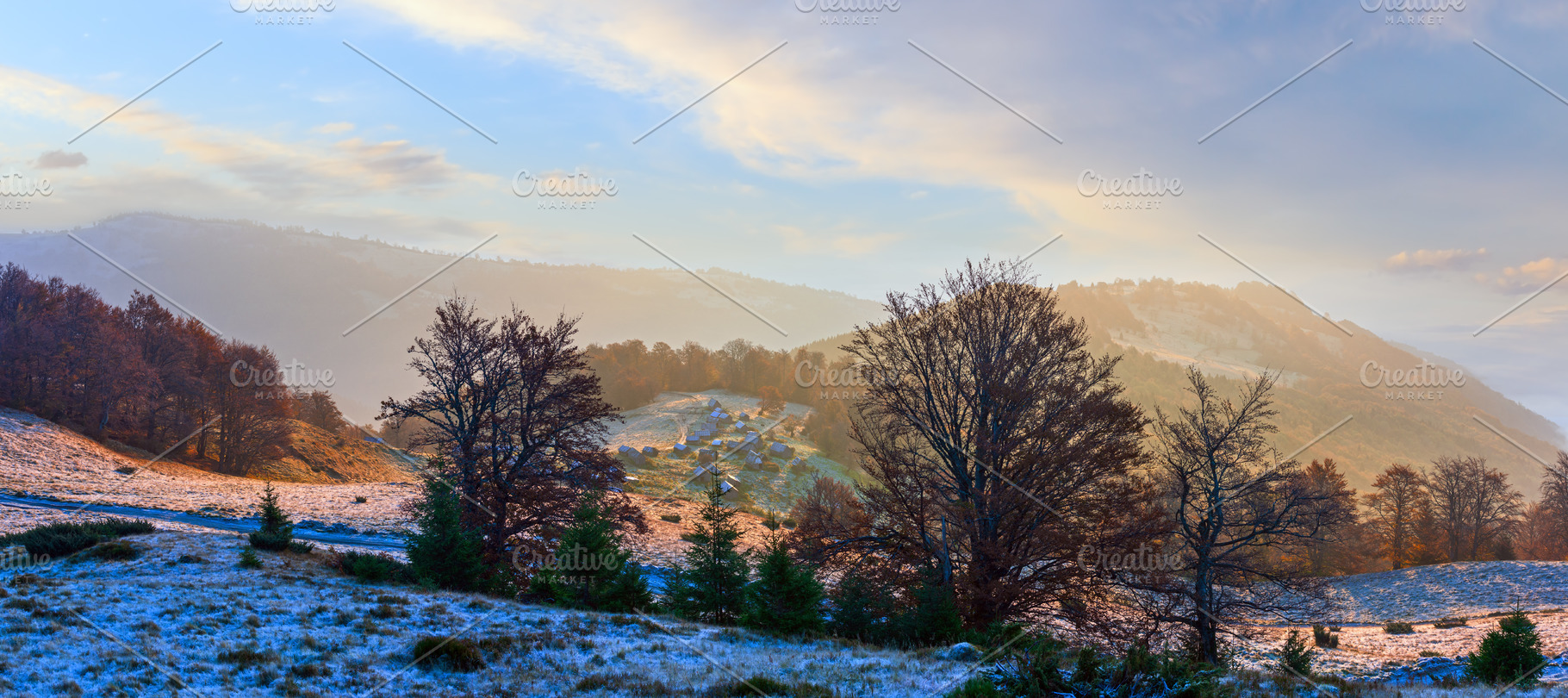 Autumn morning mountain panoramic view with sunbeams through haz, a Nature Photo by YuriyB