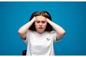 Young woman suffering from intense, a Person Photo by volodymyrshtun13795