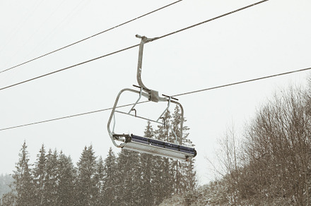 Empty ski lift in snowy day in Carpathians, a Nature Photo by AtlasStudio PRO